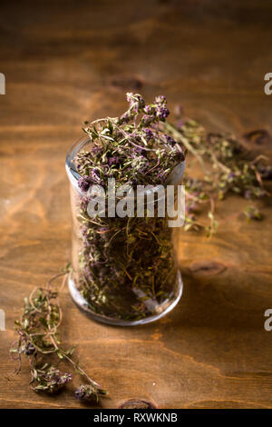 thyme in a glass jar, top view Stock Photo