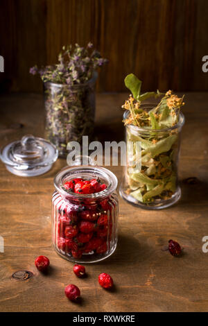 Dry linden flowers in a glass jar, top view Stock Photo