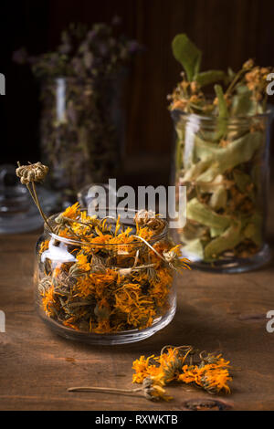 Dry calendula flowers in a glass jar Stock Photo