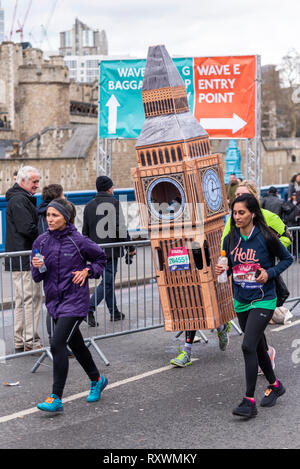 Lukas Bates running in the Vitality Big Half half marathon crossing Tower Bridge, London, UK. Big Ben costume. Elizabeth Tower. Fun runner Stock Photo