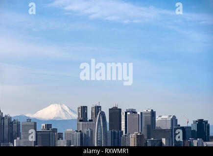 Mountain Fuji with Tokyo skylines and skyscrapers buildings in Shinjuku ward in Tokyo. Taken from Tokyo Bunkyo civic center observatory sky desk. Stock Photo