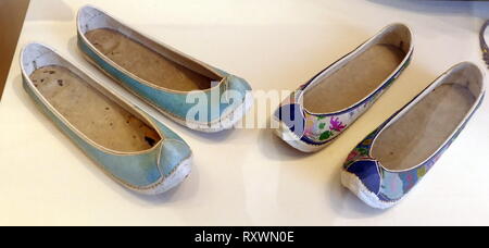Danghye (Women's shoes), Korean, early 20th century Silk, skin, and metal. The two pairs of shoes are typical traditional women's shoes with upturn toe and shallow sides. Stock Photo
