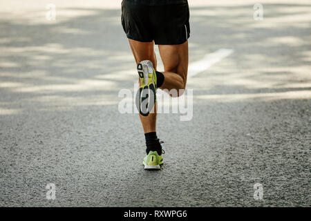legs female runner run on gray asphalt marathon Stock Photo - Alamy