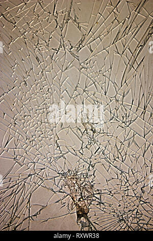 Textured cracked glass window surface with a vintage touch Stock Photo