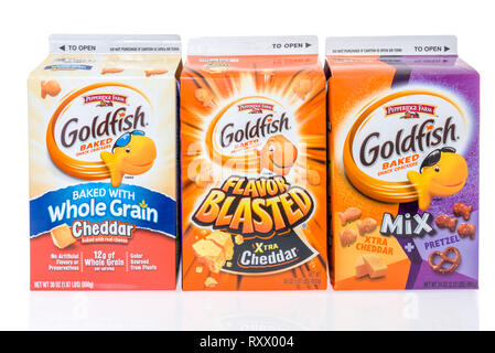 Winneconne, WI - 3 March 2019: A collection of Pepperidge Farm Goldfish baked snack crackers featuring whole grain, xtra cheddar and xtra cheddar with Stock Photo