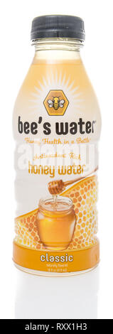 Winneconne, WI - 8 March 2019: A bottle of Bees water honey health in a bottle honey water on an isolated background Stock Photo