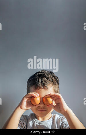 A boy painting Easter eggs. Happy Easter. Son painting Easter eggs. Happy family preparing Stock Photo