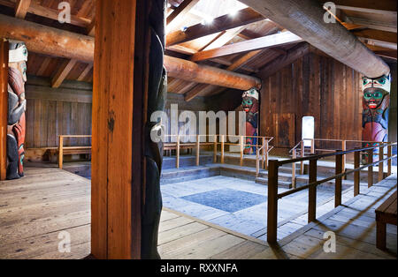 Replica of a Southeast Alaska clan or community house that would have served as living quarters for several families of the same lineage. Totem Bight State Historical Park, Ketchikan, Alaska, USA Stock Photo