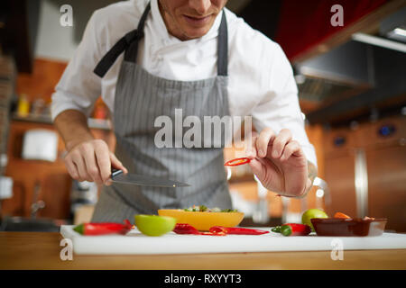 Unrecognizable Chef Cutting Vegetables Stock Photo