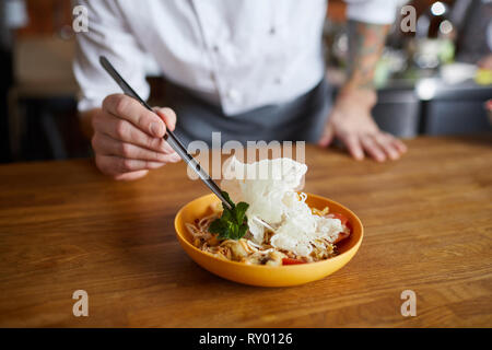 Chef Serving Asian Food Stock Photo