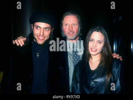 LOS ANGELES, CA - FEBRUARY 16: Actor James Haven, actor Jon Voight and actress Angelina Jolie attend United Artists' 25th Anniversary Screening of 'Midnight Cowboy' on February 16, 1994 at Director's Guild of America Theater in Los Angeles, California. Photo by Barry King/Alamy Stock Photo Stock Photo