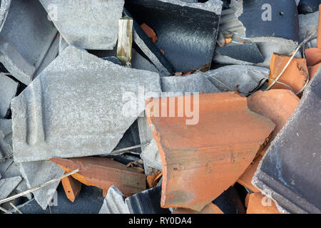 broken tiles black, gray and orange color close up Stock Photo