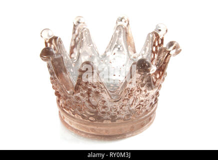 Golden glass crown close-up isolated over white Stock Photo