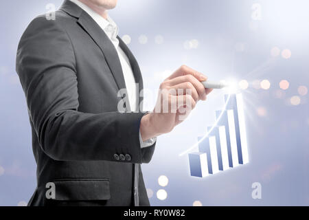 Businessman with markers drawing growing 3D bar graph on virtual screen. Business concept Stock Photo