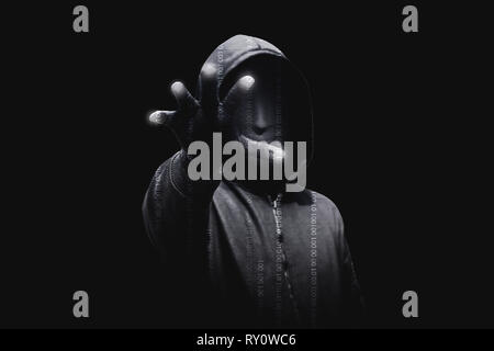 Hacker in black hoodie standing with open palms touch the digital binary code with dark background Stock Photo