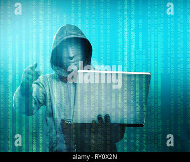 Hacker in black hoodie holding laptop with his hand and pointing to you with binary code on green background Stock Photo