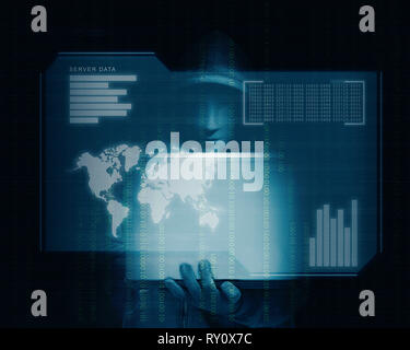 Hacker in black hoodie holding laptop with his hand and virtual screen display the server data, world maps, chart bar and binary code over dark backgr Stock Photo