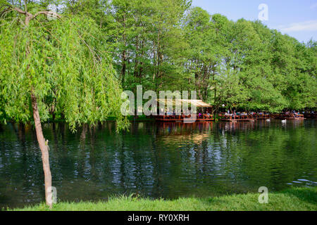 Restaurant on lakeshore, Tushemisht, source area of lake Ohrid, Drilon National Park near Pogradec, Korca region, Albania, Korça Stock Photo