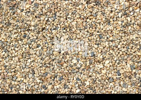 Small beautiful colorful pebbles, Multicolored little rocky background. Stock Photo