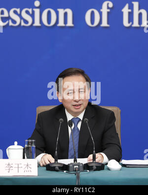 (190311) -- BEIJING, March 11, 2019 (Xinhua) -- Ecology and Environment Minister Li Ganjie attends a press conference on 'fighting resolutely to prevent and control pollution' for the second session of the 13th National People's Congress (NPC) in Beijing, capital of China, March 11, 2019. (Xinhua/Shen Bohan) Stock Photo