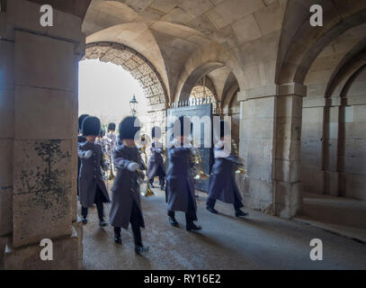 Horse Guards Parade, London, UK. 11 March, 2019. The Band of the Welsh Guards accompanies 200 members of the Commonwealth Children’s Choir in a musical celebration of the 70th anniversary of the modern Commonwealth. Image: The Band arrives through the arches at Horse Guards. Credit: Malcolm Park/Alamy Live News. Stock Photo