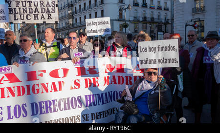 Madrid, Spain. 11th Mar, 2019. The unions protested at Puerta del Sol in Madrid  against cuts in pensions gathering hundreds of people.  In the picture, people at the protest with placards that say “The ones who you deceive will vote”. Credit: Lora Grigorova/Alamy Live News Stock Photo