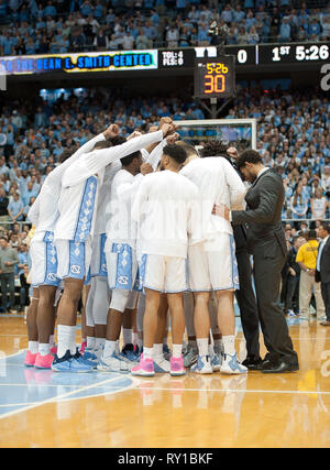 March 9, 2019 - Chapel Hill, North Carolina; USA - North Carolina Tar Heels huddle as the University of North Carolina Tar Heels defeated the Duke Blue Devils with a final score of 79-70 as they played mens college basketball at the Dean Smith Center located in Chapel Hill. Copyright 2019 Jason Moore. Credit: Jason Moore/ZUMA Wire/Alamy Live News Stock Photo
