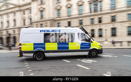 9 March 2019 - London, England. Picture of Metropolitan Police Mercedes Sprinter van in motion driving in capitol. Stock Photo
