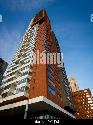 Montevideo towering upwards towards the sky is one of the tallest buildings in the modern city of Rotterdam and well known for its modern architecture Stock Photo