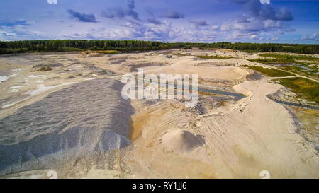 Aerial view of the limestone quarry area. Seen the white sedimentary rocks in limestone and crushed forms Stock Photo