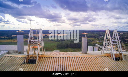 A loader in the elevator carrying stones. It is one of the process inside the limestone factory Stock Photo
