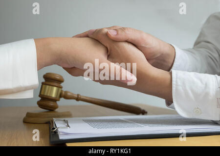Lawyer touch and respect clients to trust partnership.Trust Promise Concept. Stock Photo