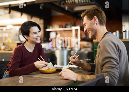Cheerful Couple in Chinese Food Restaurant