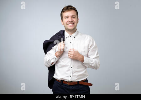 Young european businessman smiling looking at camera. Stock Photo