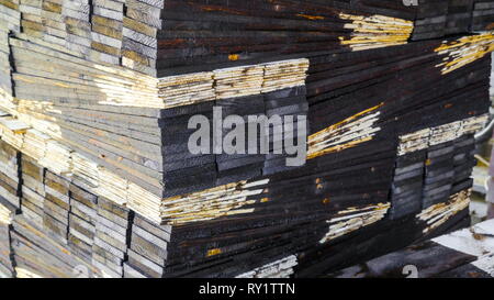 Closer look of the piles of the wooden shingles after being cut by the wood cutting machine Stock Photo