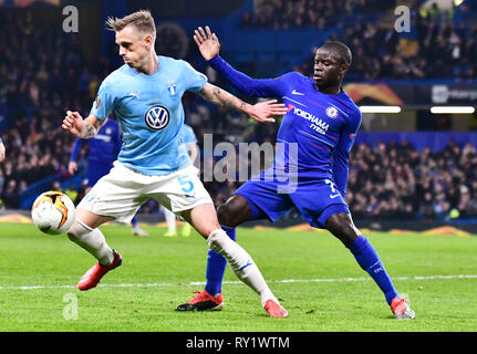 LONDON, ENGLAND - FEBRUARY 21, 2019: Soren Rieks of Malmo and N'Golo Kante of Chelsea pictured during the second leg of the 2018/19 UEFA Europa League Round of 32 game between Chelsea FC (England) and Malmo FF (Sweden) at Stamford Bridge. Stock Photo