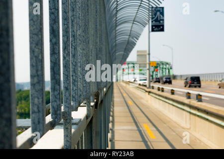 Close up of an anti-suicide bridge fence with a blured background Stock Photo