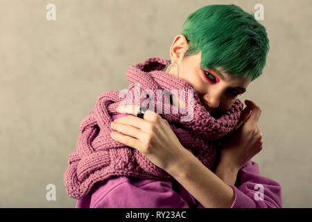 Nice green haired woman looking at you Stock Photo