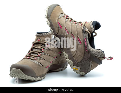 One pair of Merrell brown walking boots isolated on white background Stock Photo