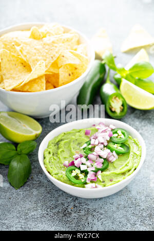 Guacamole with red onion and Jalapeno pepper Stock Photo