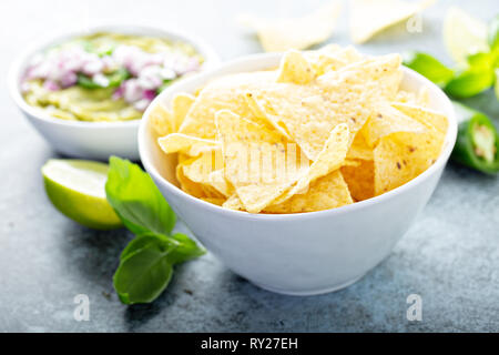 Corn chips with guacamole Stock Photo