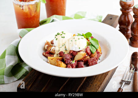 Breakfast potatoes with eggs Benedict and beef Stock Photo