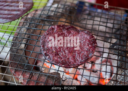 Fresh prepared asian black sticky rice pancake. Traditional thai cuisine made of fresh ingredients. Stock Photo