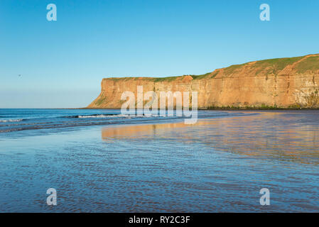 Beautiful beach at Saltburn-by-the-sea on the coast of North Yorkshire, England. View to the high cliffs of Huntcliff. Stock Photo