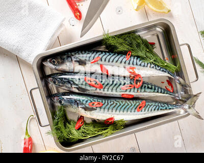 Fresh mackerel being prepared to be roasted Stock Photo