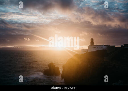 View of the lighthouse and cliffs at Cape St. Vincent in Portugal at sunset. The most south-western point of Europe. Stock Photo