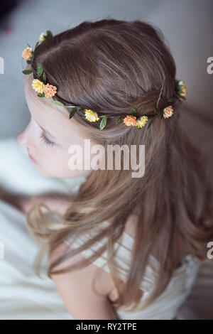 Young bridesmaid wearing floral headdress Stock Photo