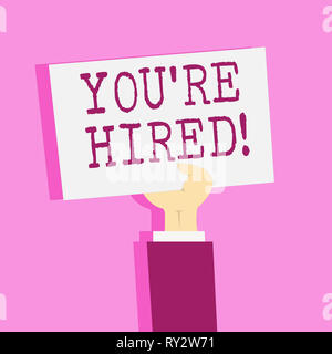 Writing note showing You Re Hired. Business concept for New employee recruited Worker selected Stock Photo