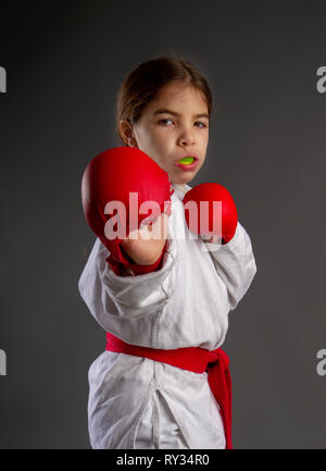 Karate kid strikes Stock Photo