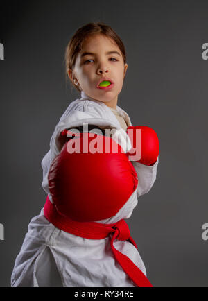 Karate kid strikes Stock Photo